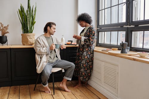 Free Couple Having Breakfast at Home Stock Photo