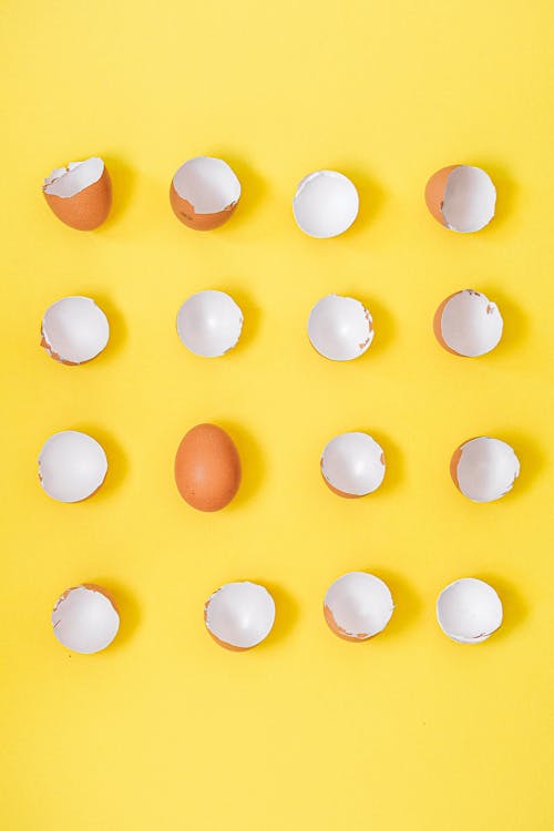 Broken Eggshells on a Yellow Background