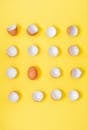 Broken Eggshells on a Yellow Background