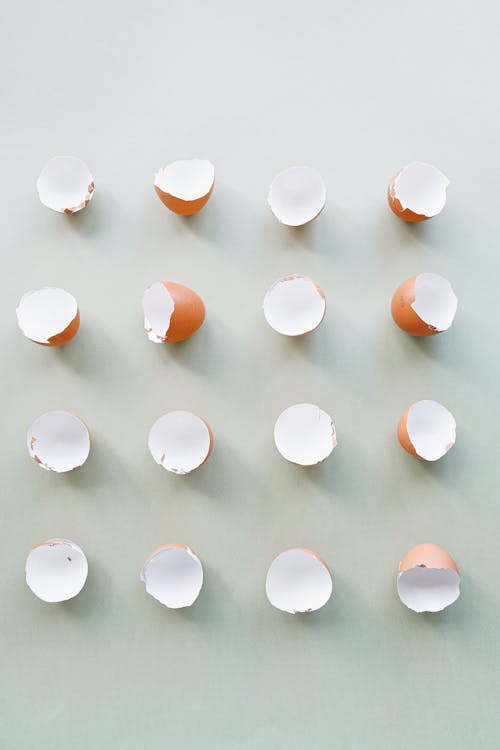 Broken Eggshells on a Plain Background