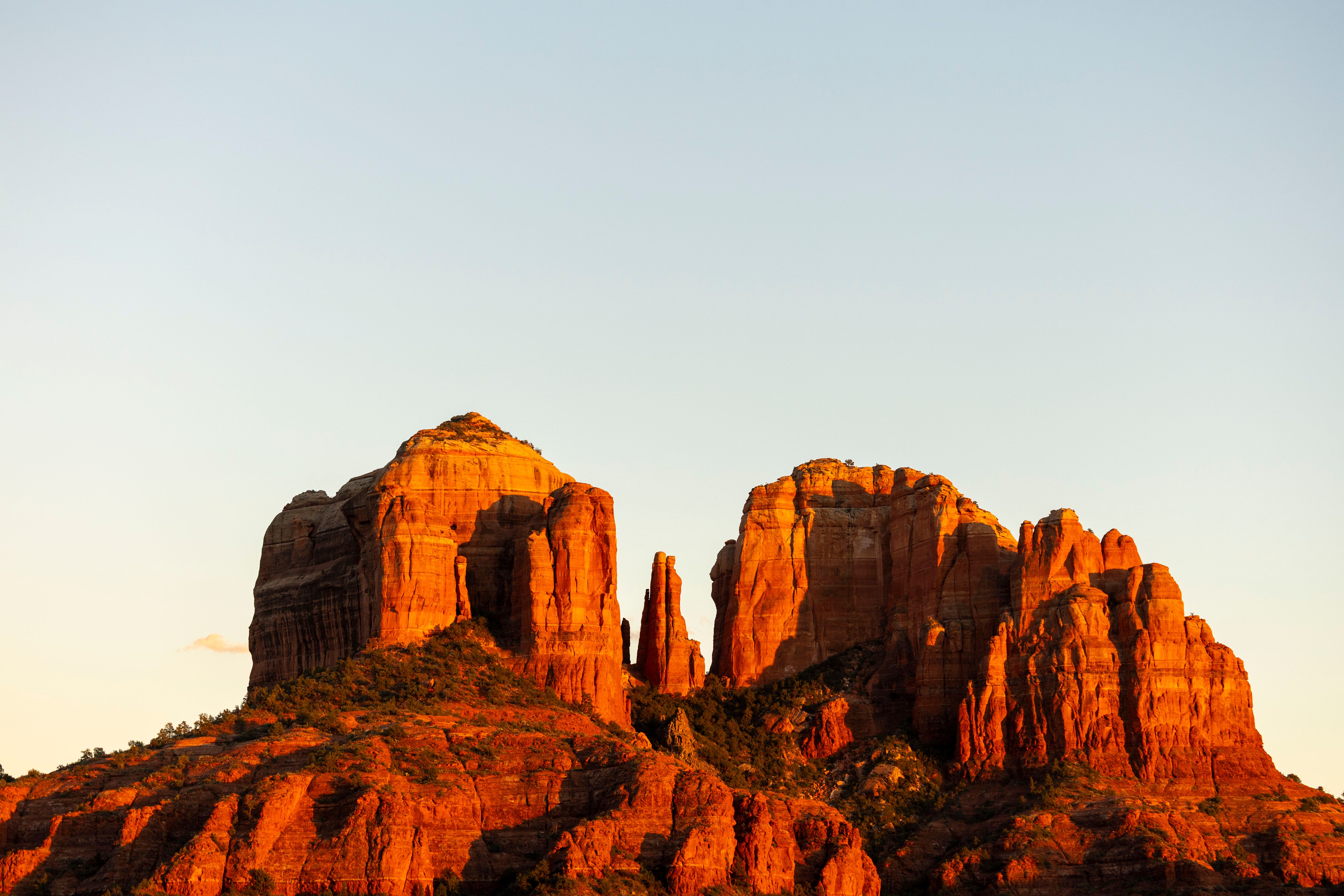 Stunning view of Cathedral Rock in Sedona, showcasing vivid red rock formations at sunset.