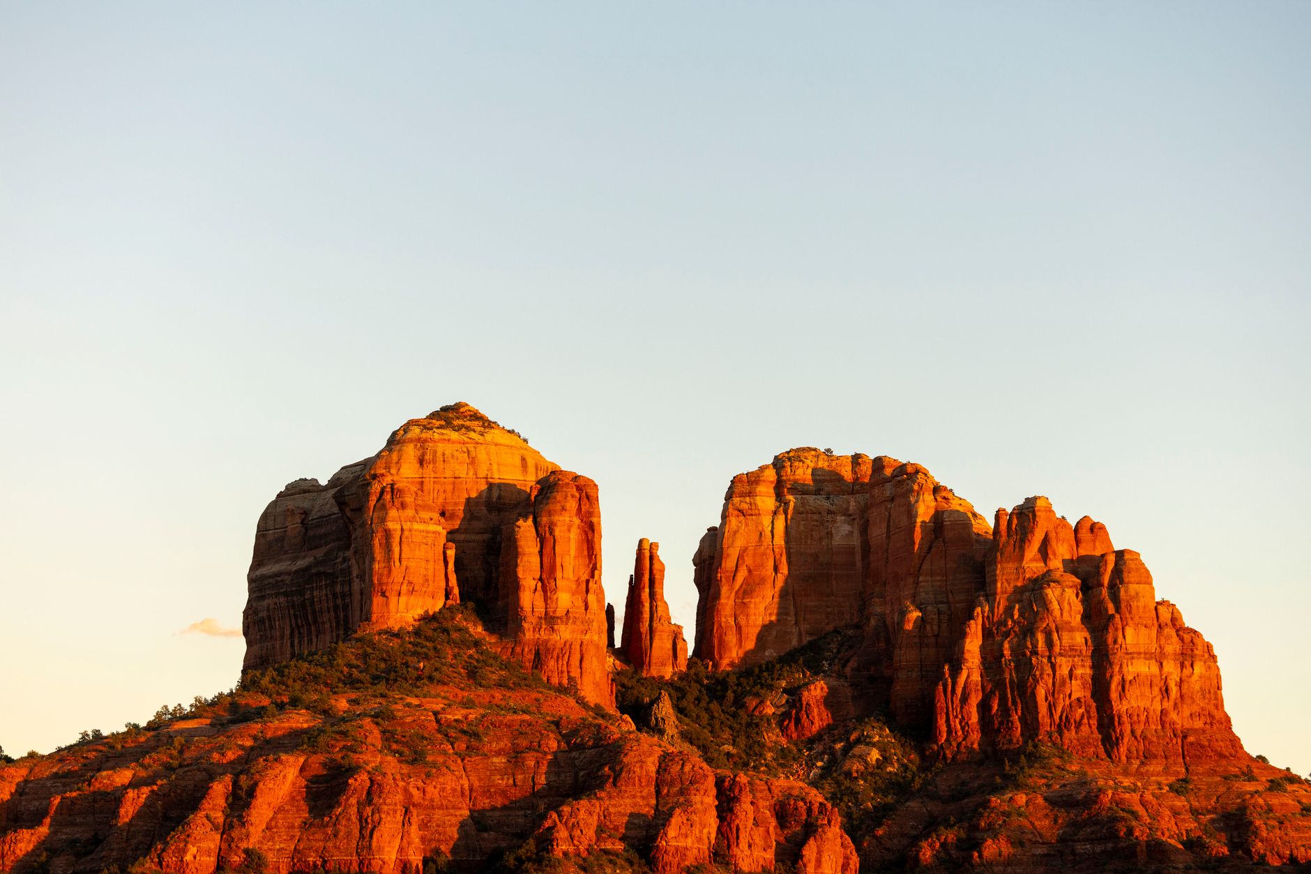 Stunning view of Cathedral Rock in Sedona, showcasing vivid red rock formations at sunset.