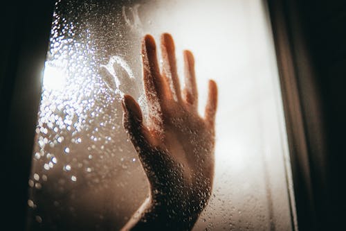Free Persons Hand on Glass Window Stock Photo