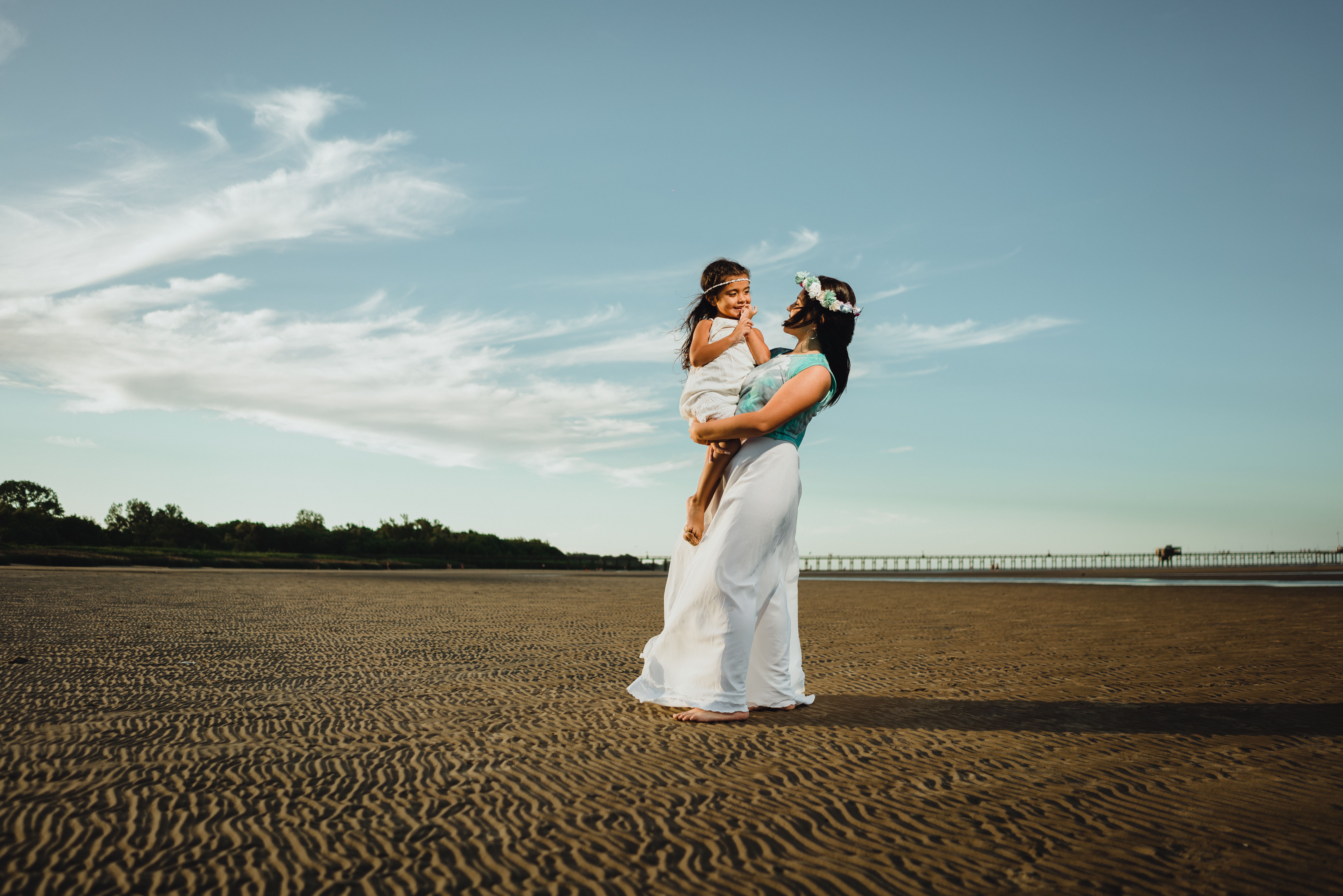 Mother and Daughter Enjoy Beach Sunset · Free Stock Photo
