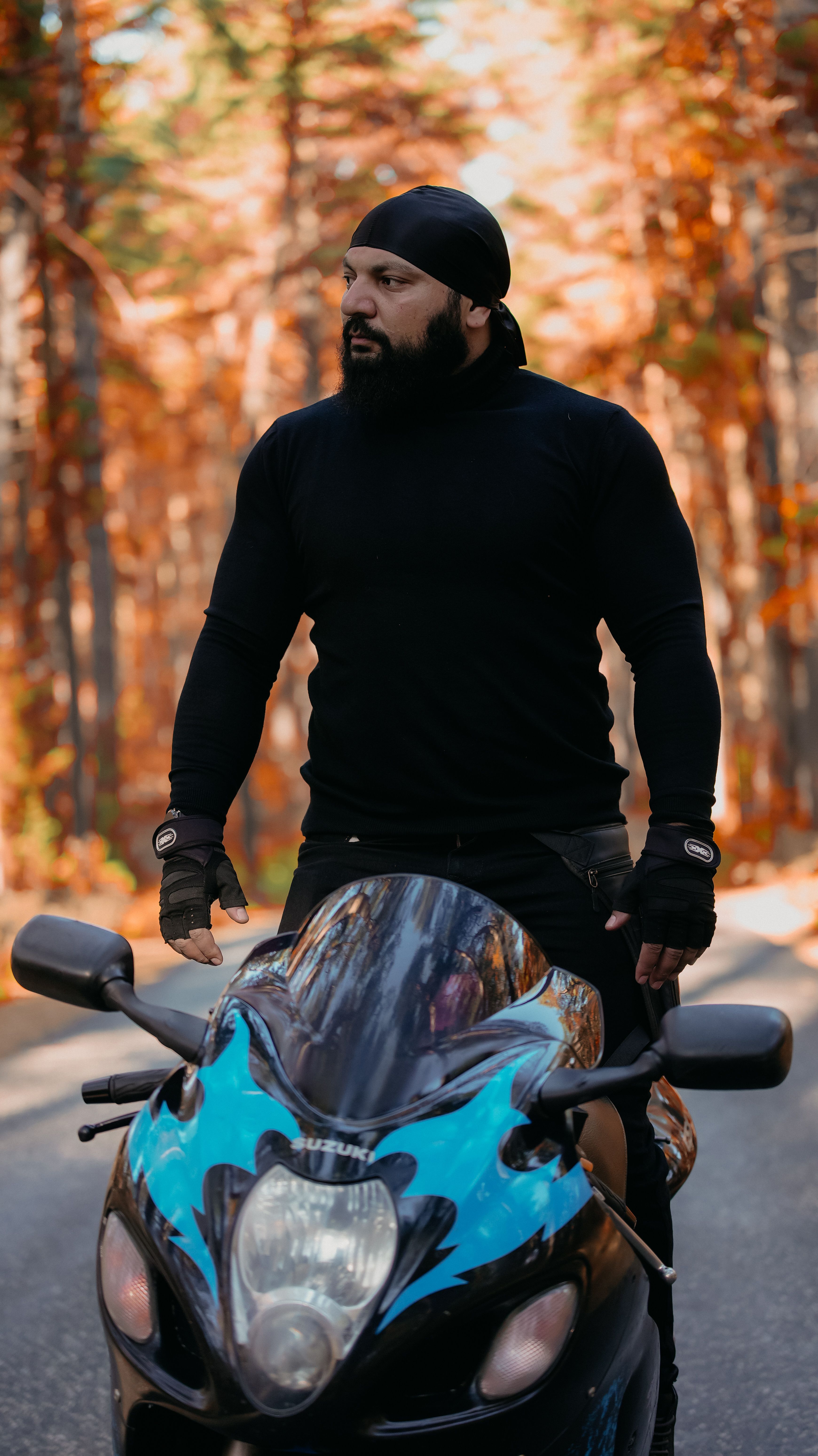 Man on Motorcycle in Autumn Forest · Free Stock Photo