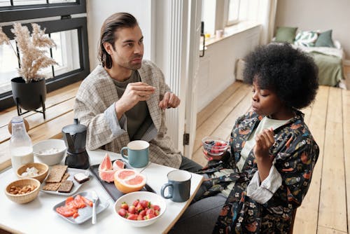 Free Couple Having Breakfast at Home Stock Photo