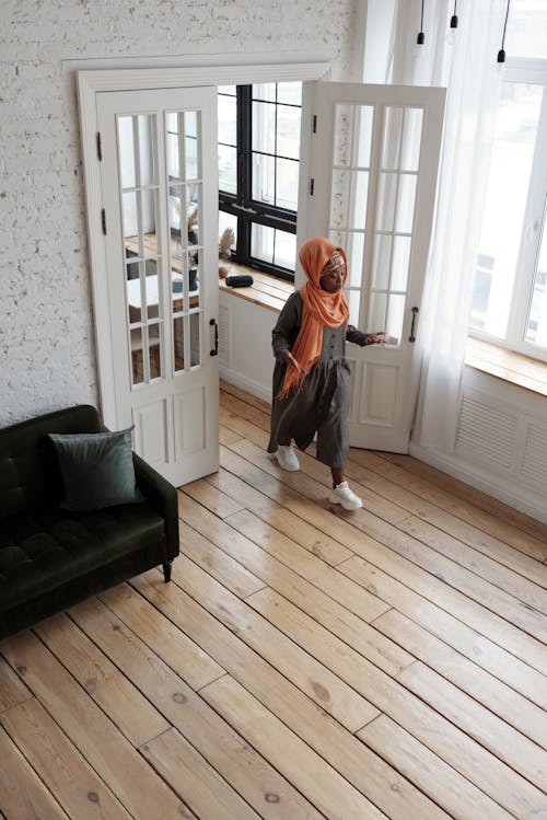 Free High Angle of Woman Walking into Room Stock Photo