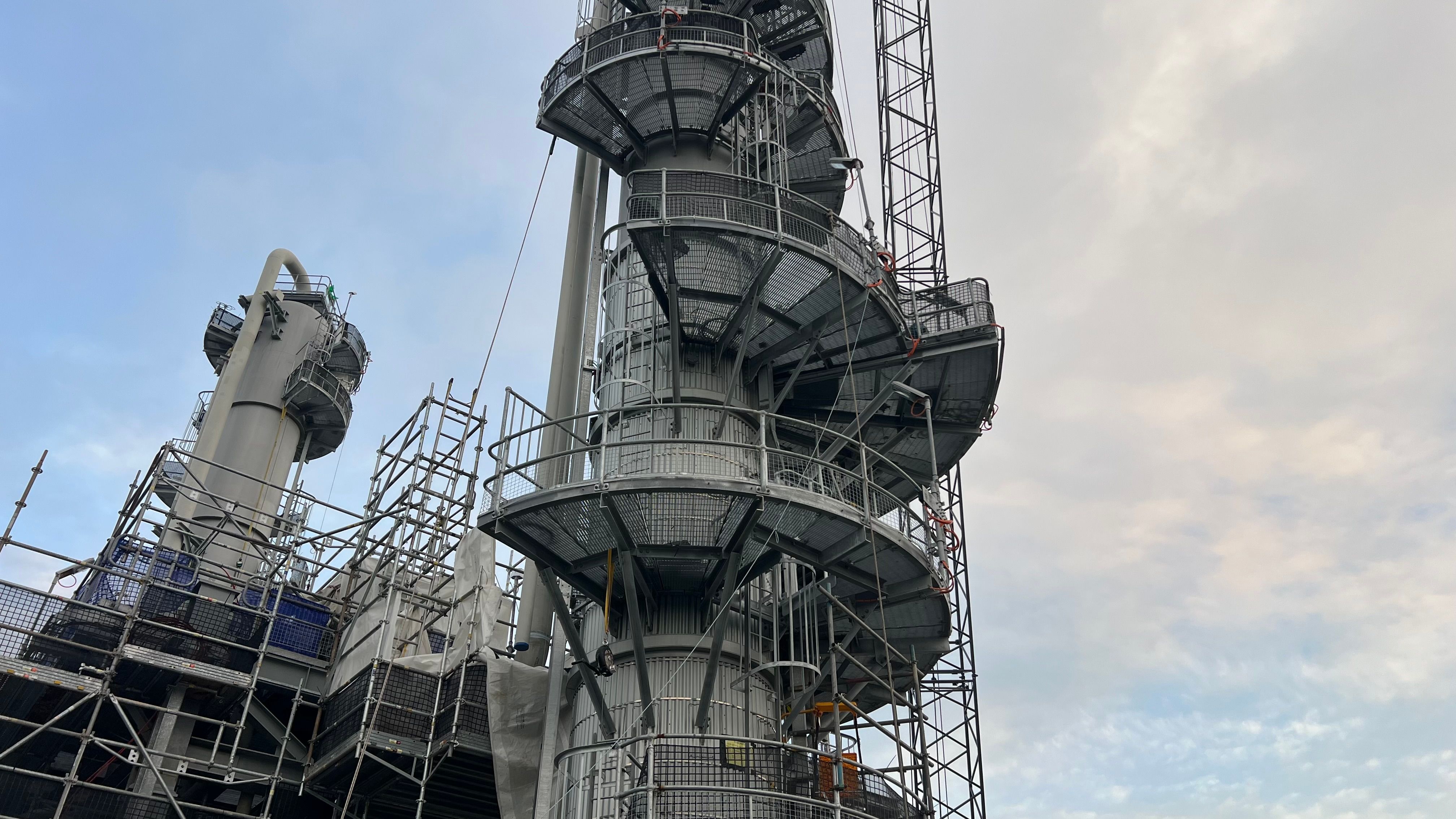 Industrial Refinery Tower with Scaffolding · Free Stock Photo