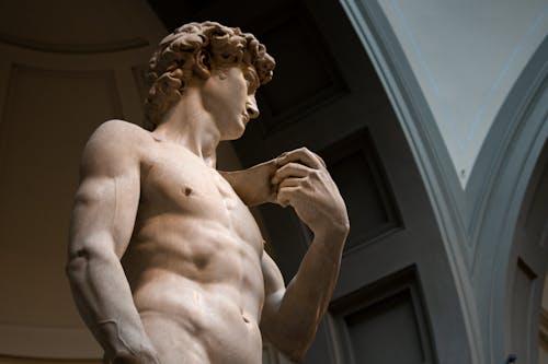 Free Low Angle Shot of Man Sculpture Stock Photo
