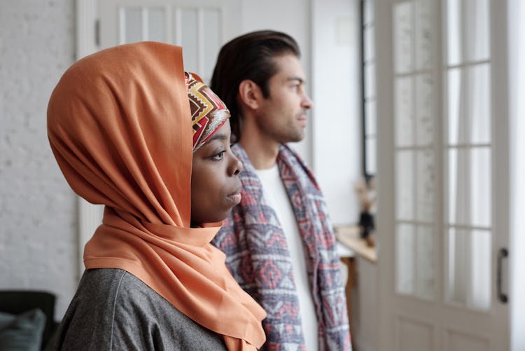 Muslim Couple Looking Out The Window