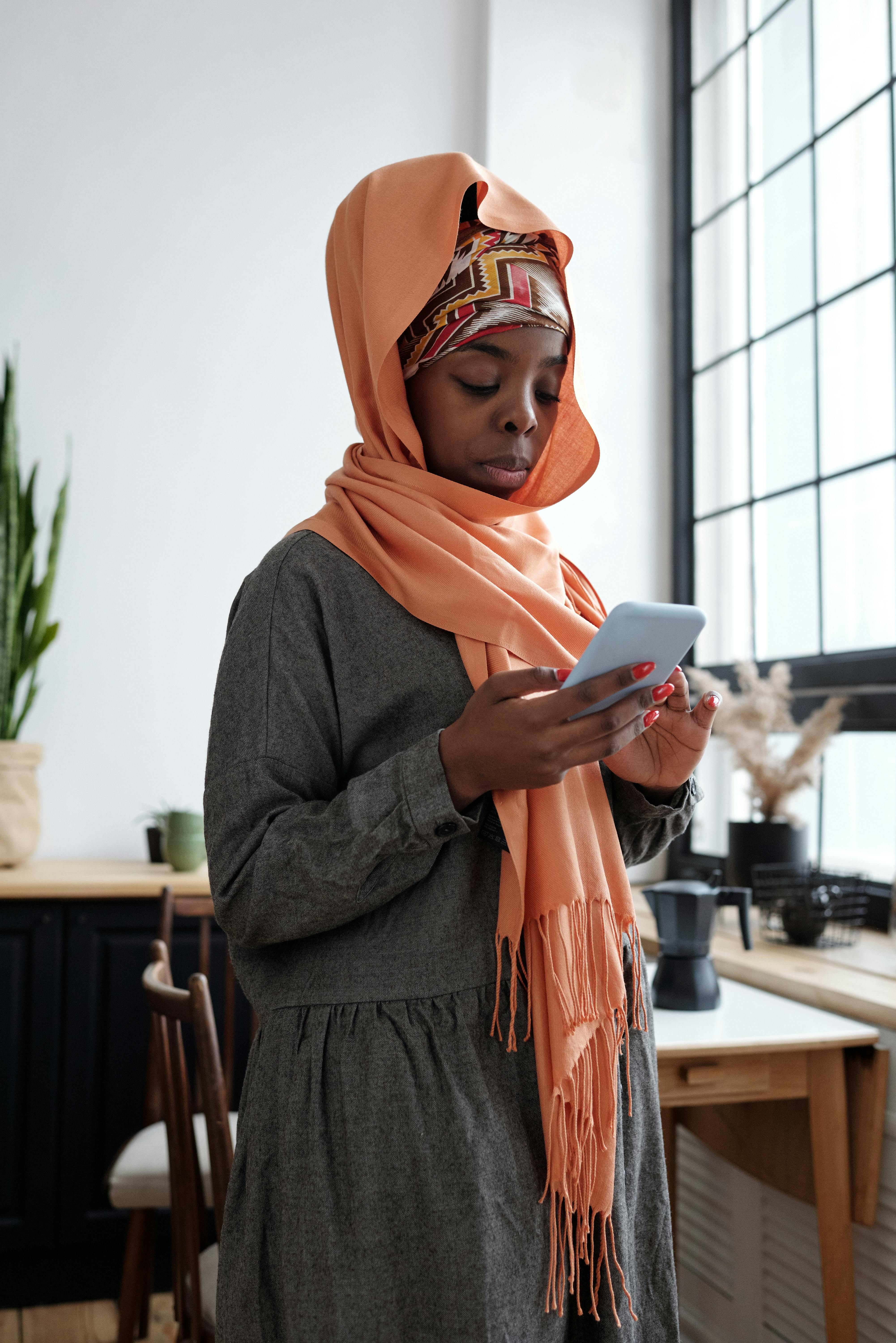 muslim woman using smartphone