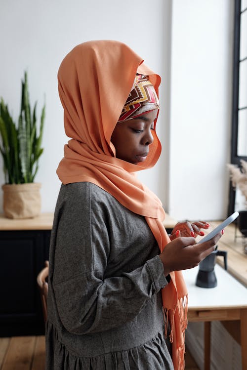 Muslim Woman Checking Smartphone