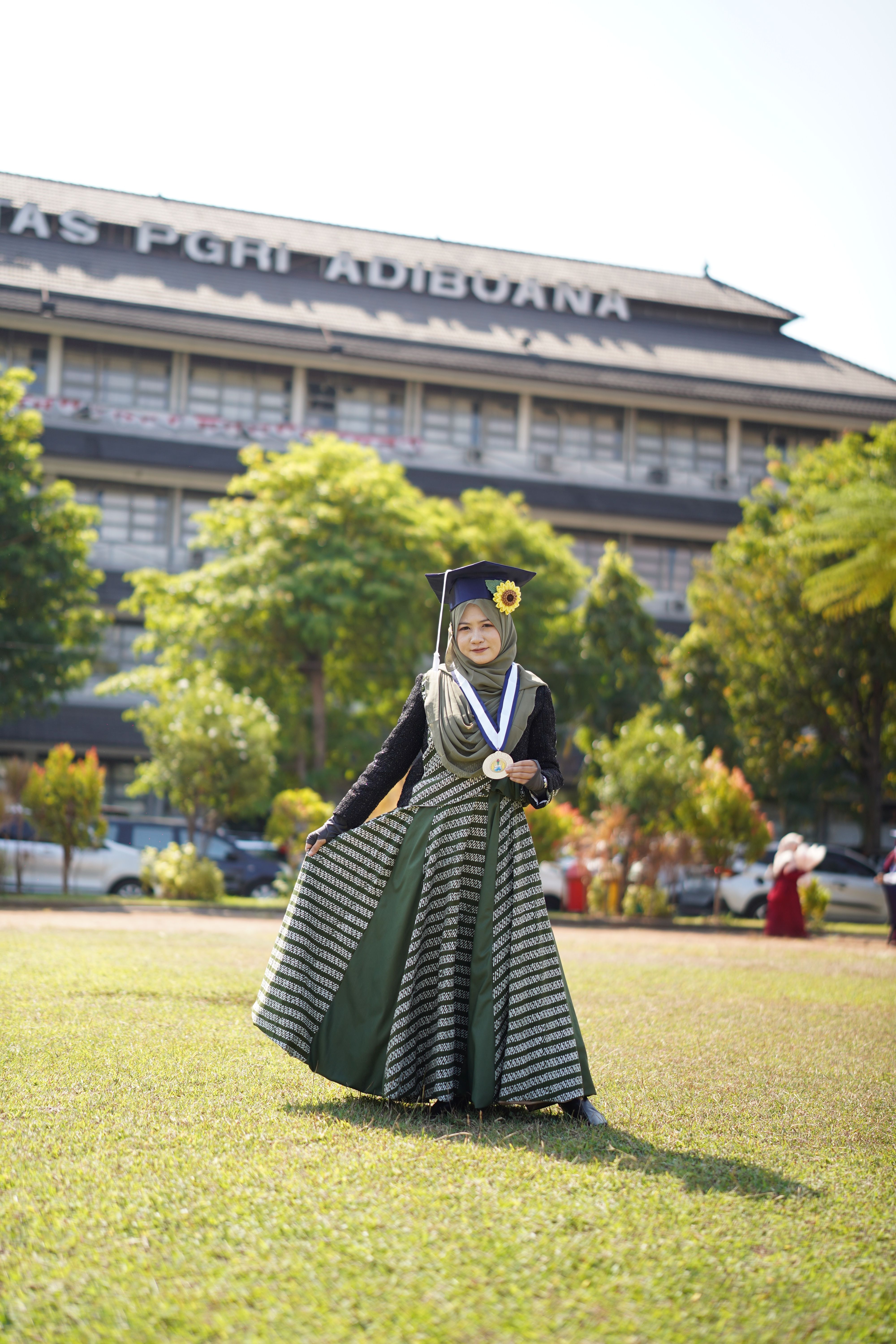 Graduation Celebration at University with Cap and Gown · Free Stock Photo