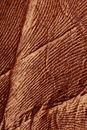 Closeup abstract brown textured background of stucco with cracks on old rough surface