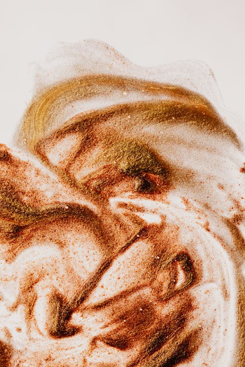 Brown paint texture on white paper