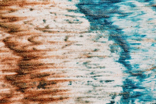Vibrant abstract texture with blue and brown sand patterns, artistic and creative composition.
