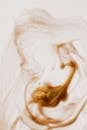 Abstract textured surface of picture made of brown paint on white sheet
