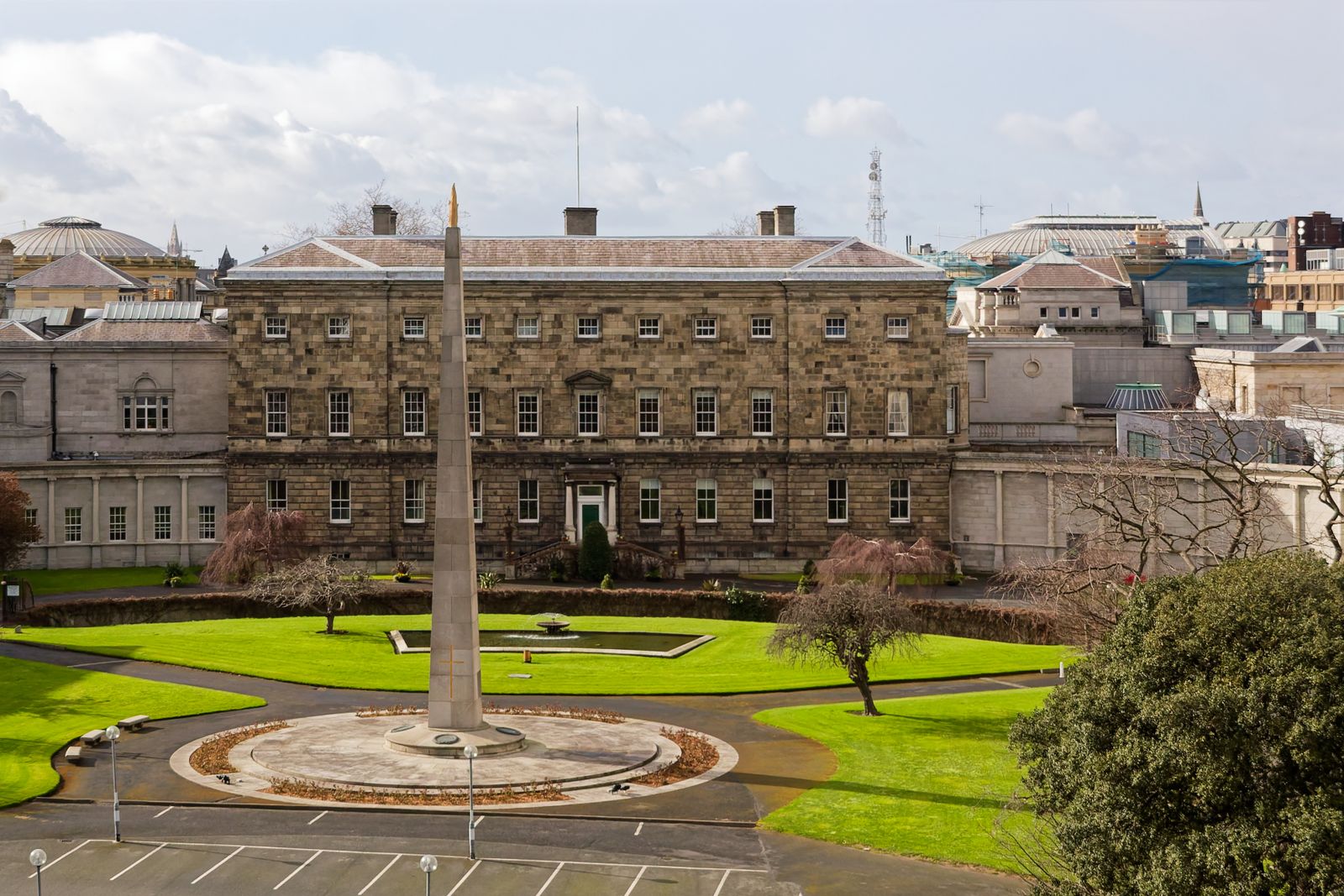 View of Leinster House and surrounding garden on a sunny day in Dublin, Ireland