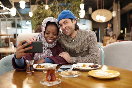 Couple Taking Selfie While Eating