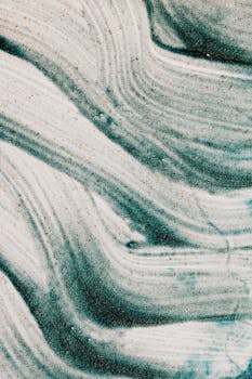 Explore the fluid lines and textured patterns of this wavy green abstract art piece.