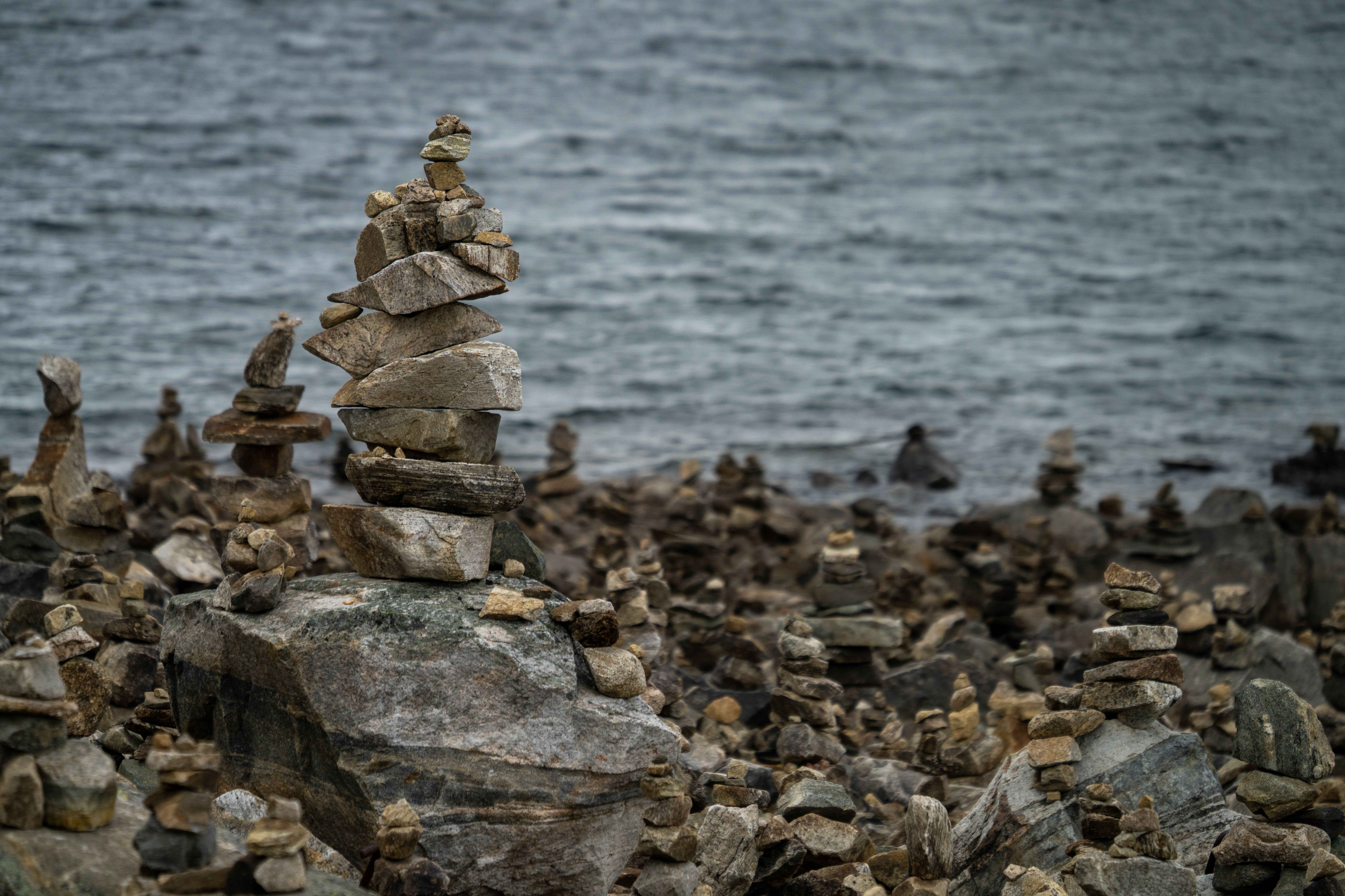 Balanced Stone Cairns by the Waterside · Free Stock Photo