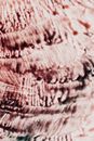 From above closeup of creative watercolor backdrop with vertical lines and dark droplets on surface