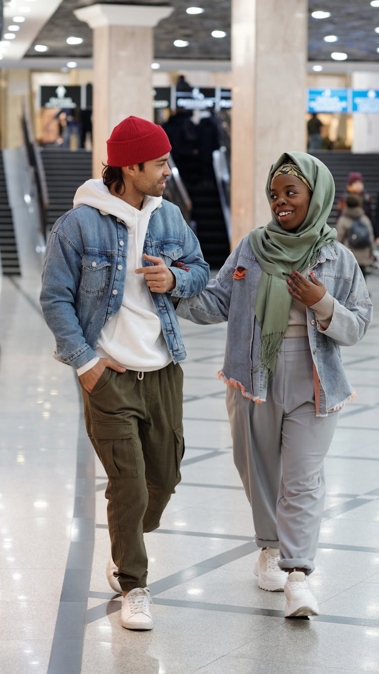 Muslim Couple Walking In Shopping Mall