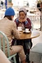 Muslim Couple Having Coffee