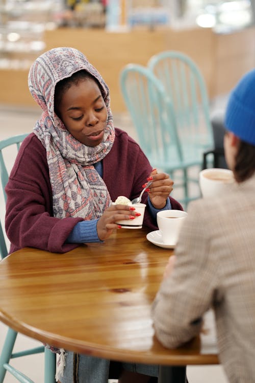 Muslim Woman Eating Ice Cream