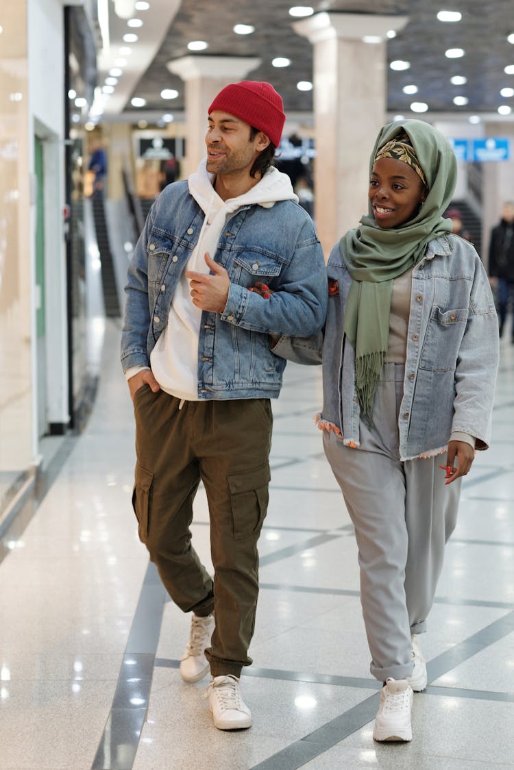 Muslim Couple Walking In Shopping Mall