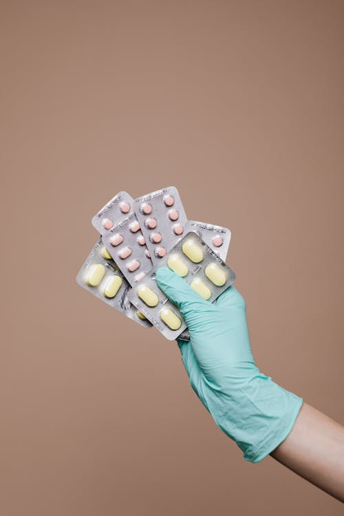 Free Person Holding Medicines Stock Photo