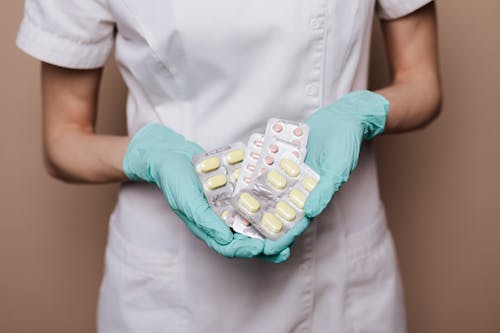 Person Holding Medicines