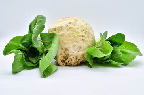 Free Green Vegetables on White Surface Stock Photo