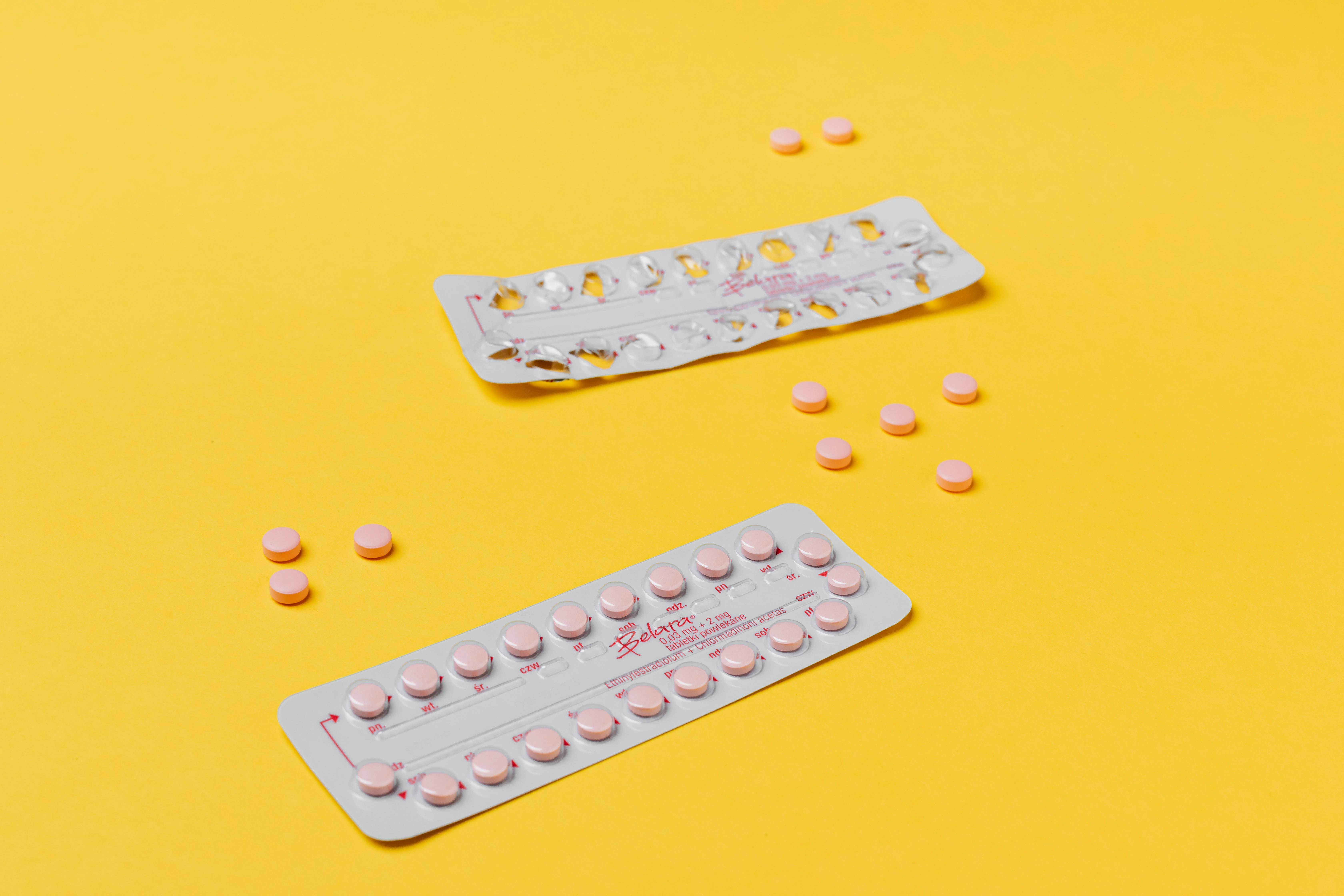 Download Spilled Bottle Of Yellow Capsule Pills Free Stock Photo PSD Mockup Templates
