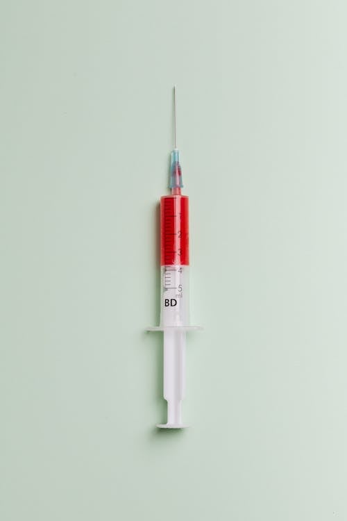 Free Syringe with Red Liquid Stock Photo
