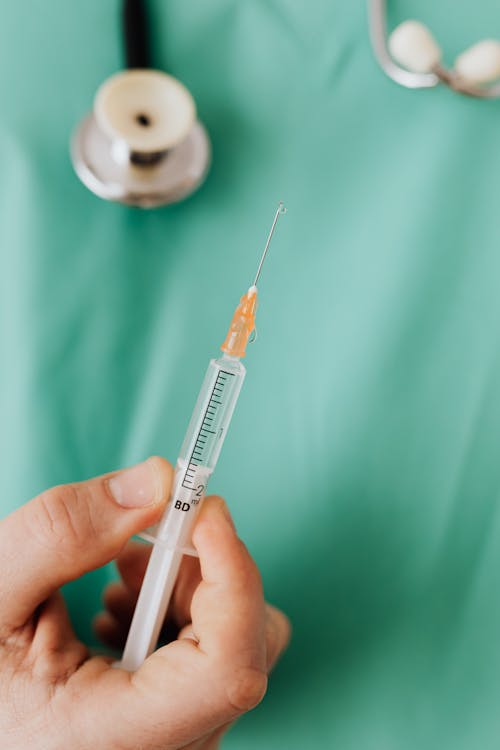 Free Close-up View Of Person Holding A Vaccine Stock Photo