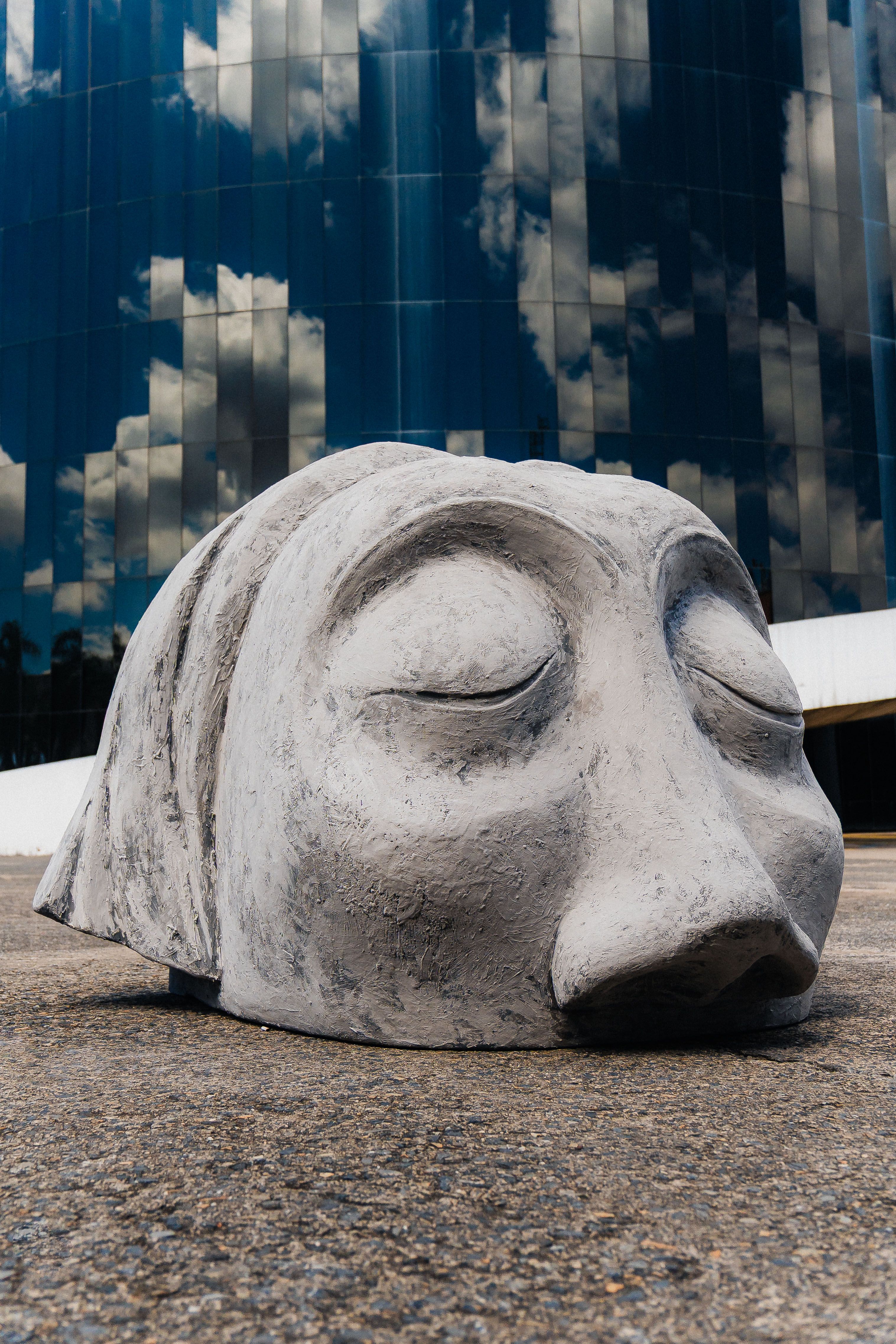 Abstract Stone Sculpture Outdoors Against Modern Building · Free Stock ...