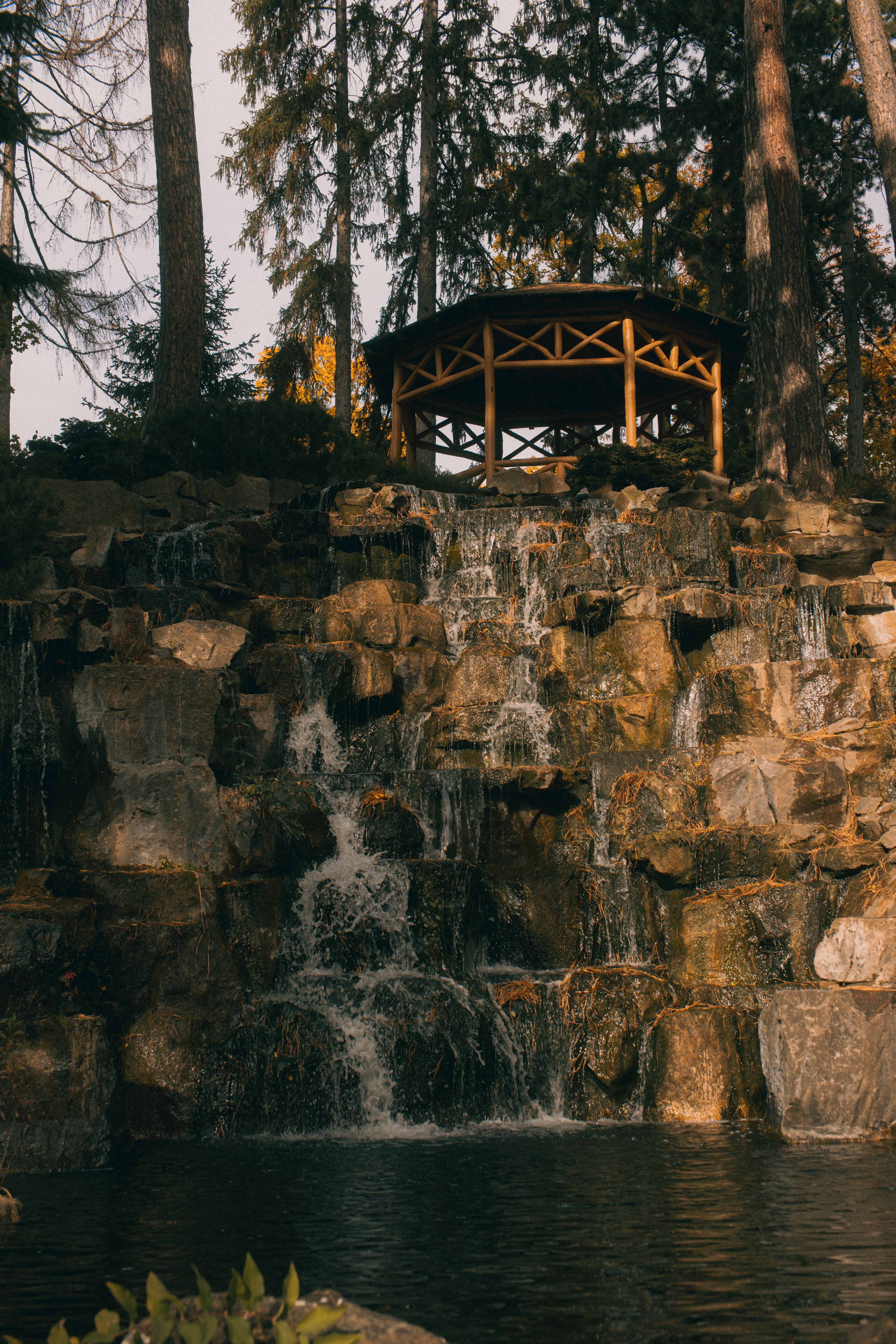 Rustic Gazebo Overlooking Scenic Waterfall · Free Stock Photo