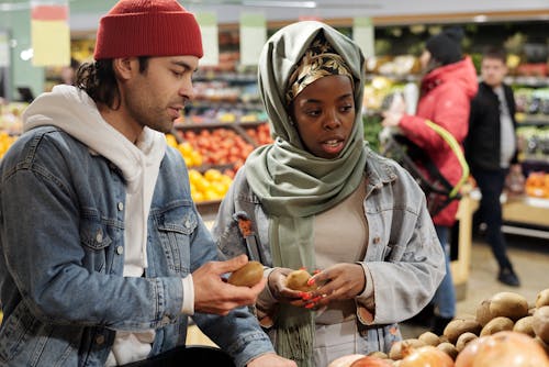 Muslim Couple Buying Groceries