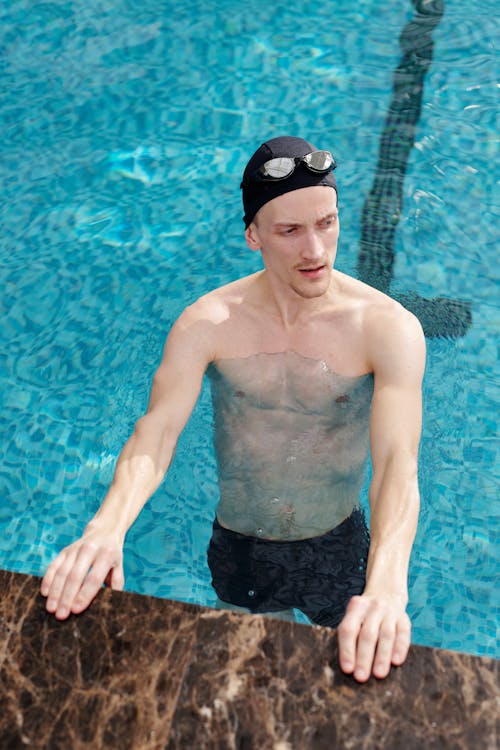 Man in Black Shorts in Swimming Pool
