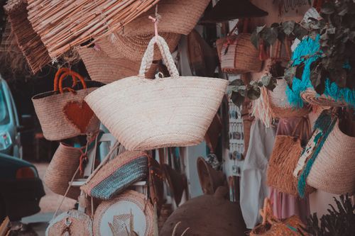 Free Explore a colorful display of handmade wicker baskets in Erriadh market, Tunisia. Stock Photo