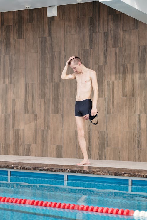 Photo Of Man Standing On Poolside