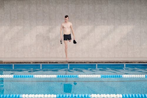 Photo Of Man Standing On Poolside