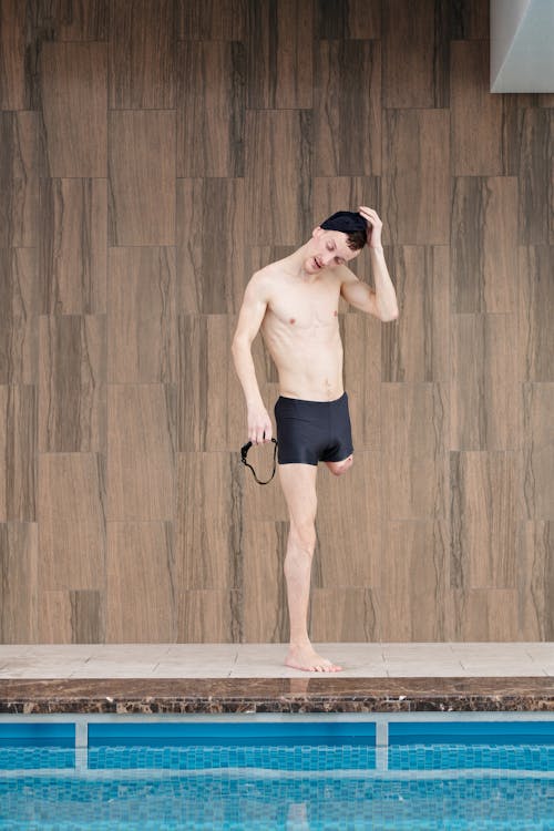 Photo Of Man Standing Beside Pool 