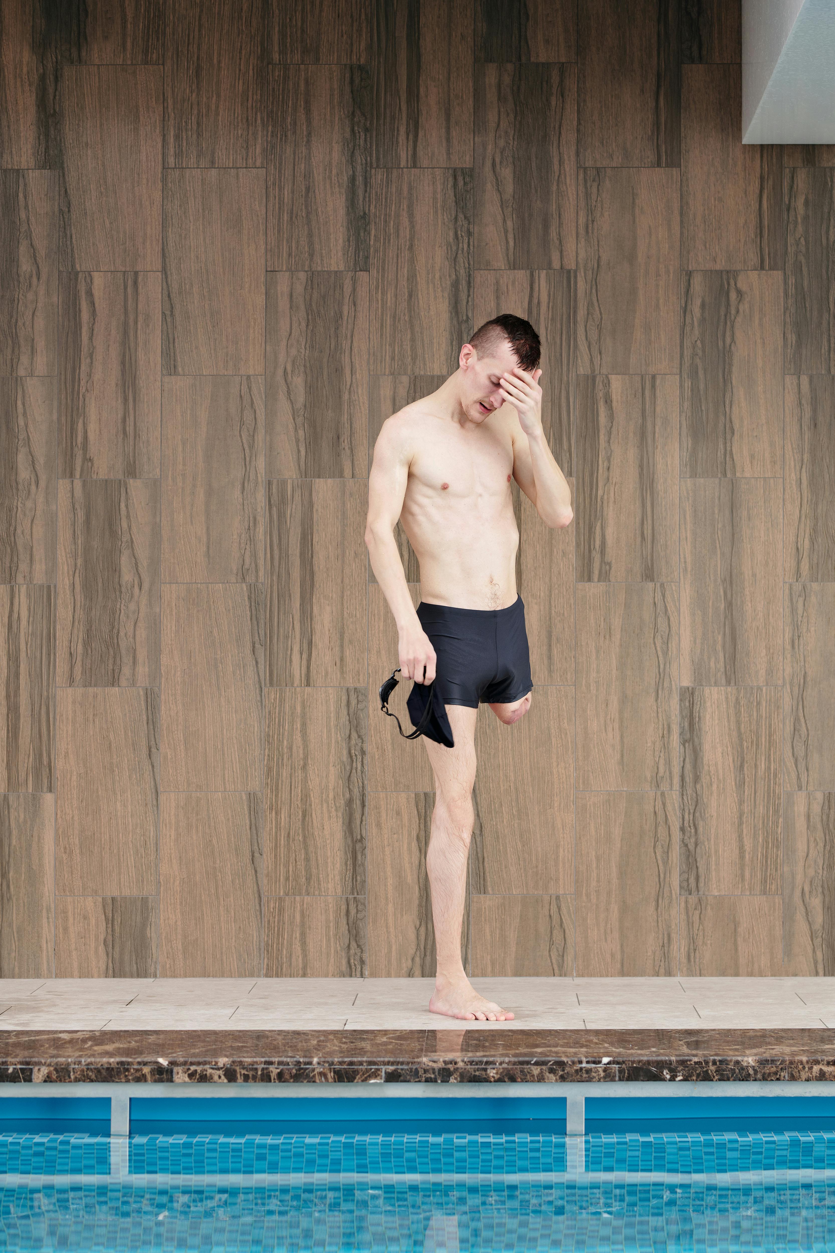 Photo Of Man Standing On Poolside · Free Stock Photo