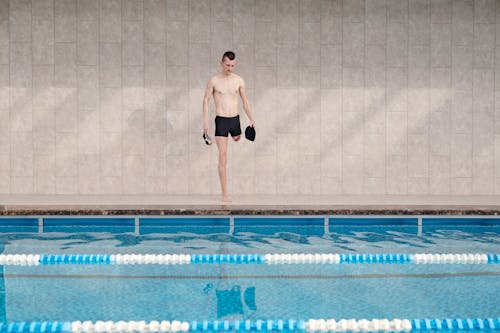 Photo Of Man Standing On Poolside