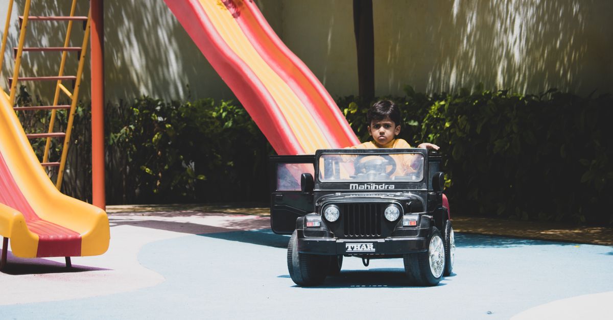Kid Drive Child Driving a Ride On Toy Car · Free Stock Photo