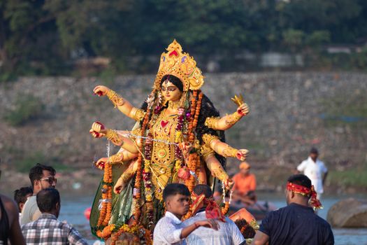 Vibrant Durga idol during traditional immersion ceremony in Jamshedpur, India.