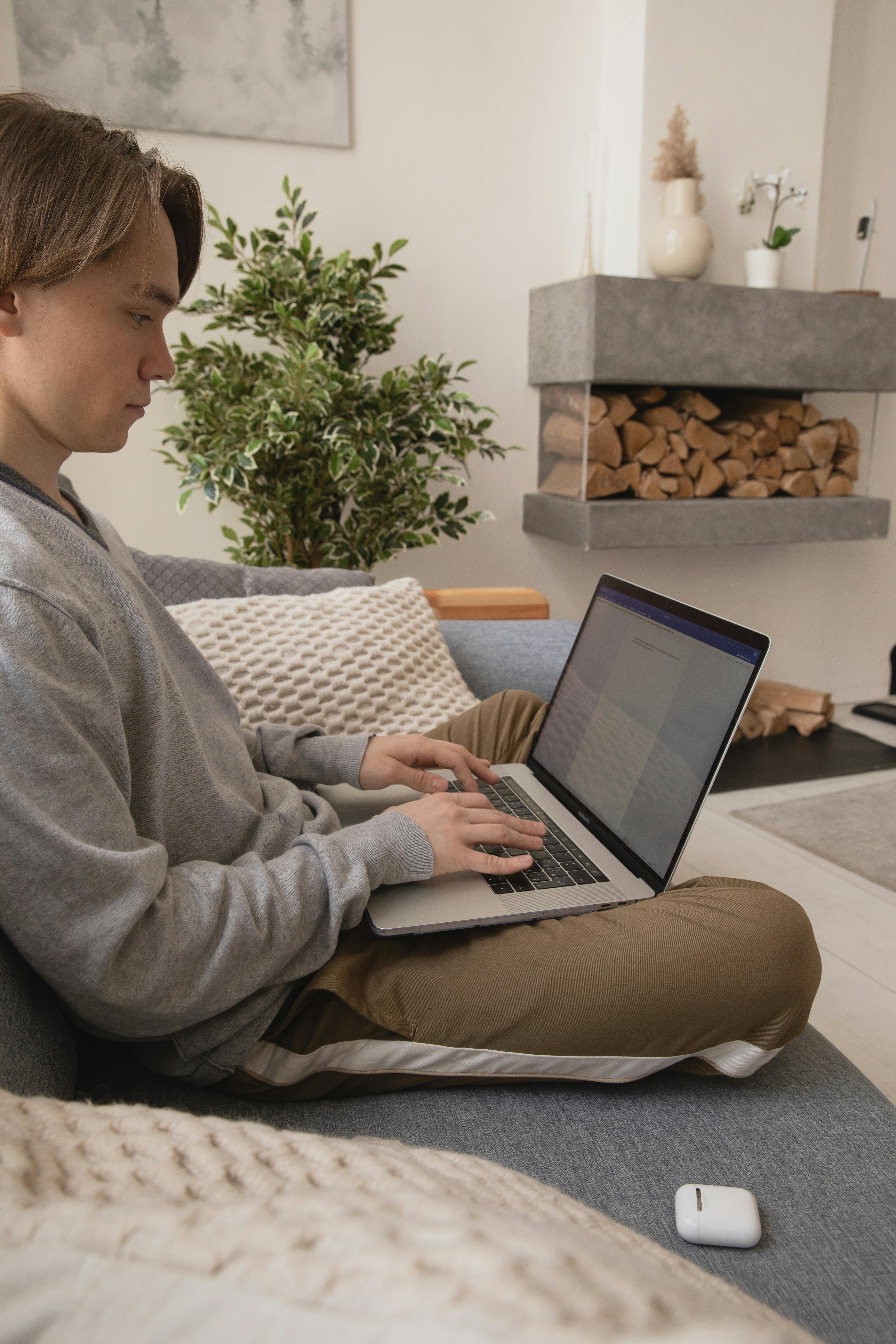 photo of man sitting on sofa