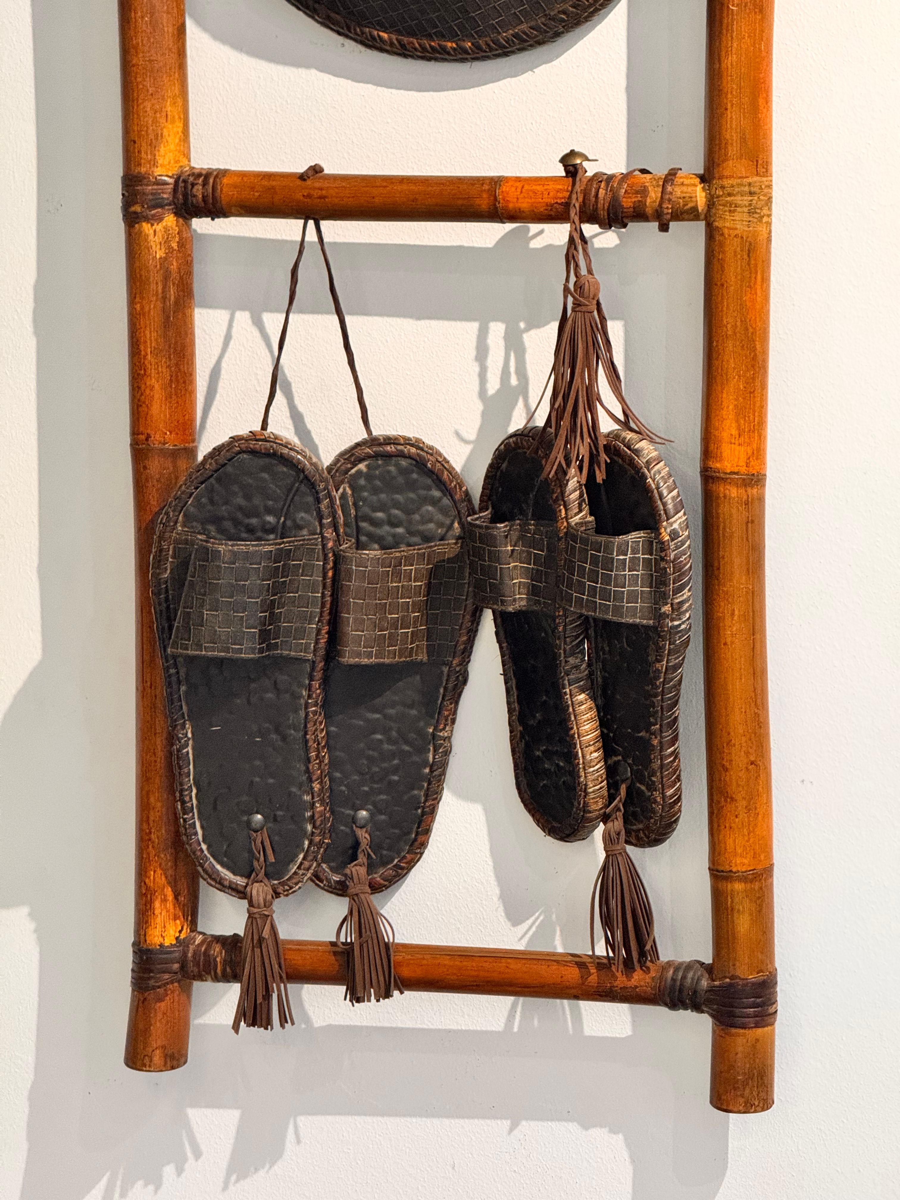 Traditional Sandals Hanging on Bamboo Ladder · Free Stock Photo